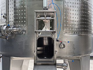 Wine fermentation tanks with round excavation and flooding